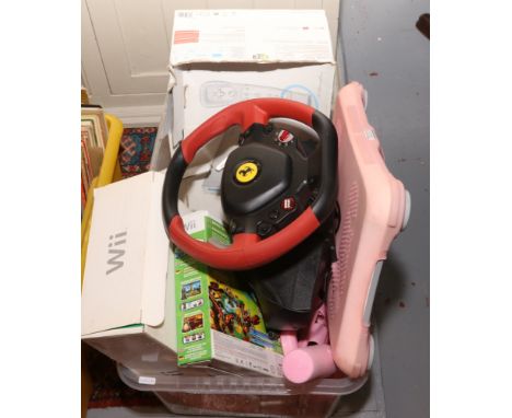 A box of video gaming equipment to include Wii console, Xbox steering wheel etc.