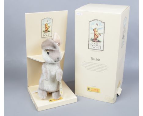 A boxed Steiff classic Pooh rabbit mohair soft toy.