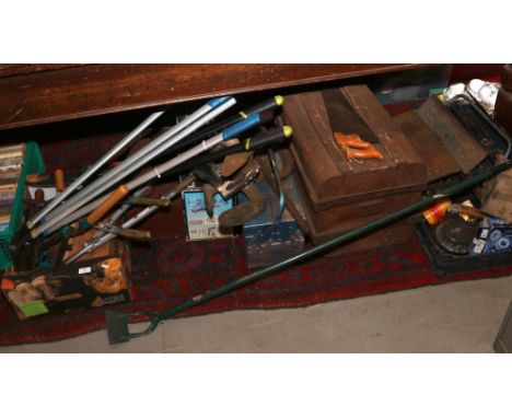 A large quantity of tools including gardening tools, boxed mitre saw and cantilever tool boxes.