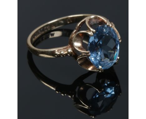 A 9ct gold dress ring set with a blue gem stone, assayed Birmingham 1970, size L1/2.