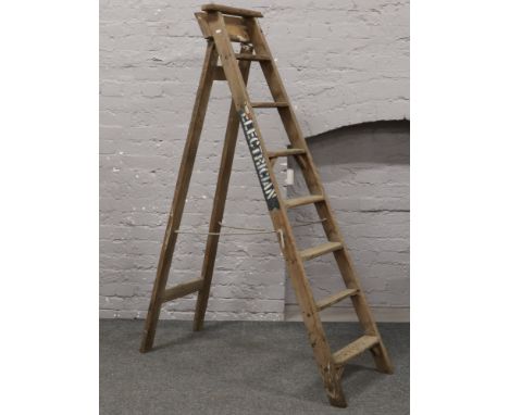 Bratts Ladders, a wooden 8 tread folding step ladder, stencilled Electrician.