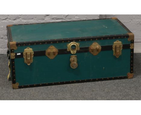 A vintage canvas bound steamer trunk.