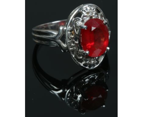 An 18ct white gold padparadscha sapphire and diamond ring with certificate, size N. (5.81g).