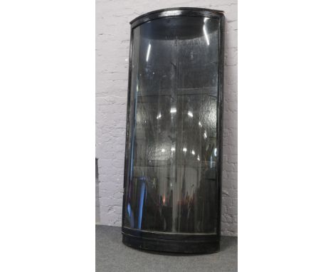 A Victorian bow front ebonized display cabinet with four glass shelves, 225cm high 97cm wide.