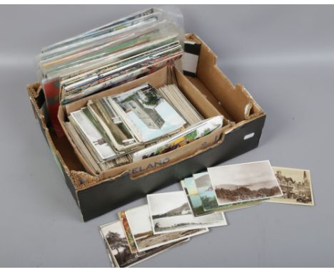 A box of DC comic Green Arrow magazines to include vintage postcards.