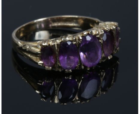 A 9ct gold five stone amethyst ring, size N.