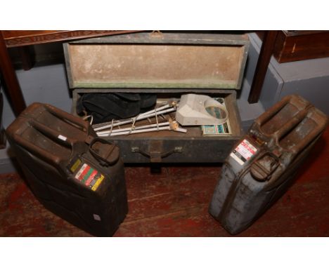 Two steel jerry cans and a wooden case containing a task lamp.