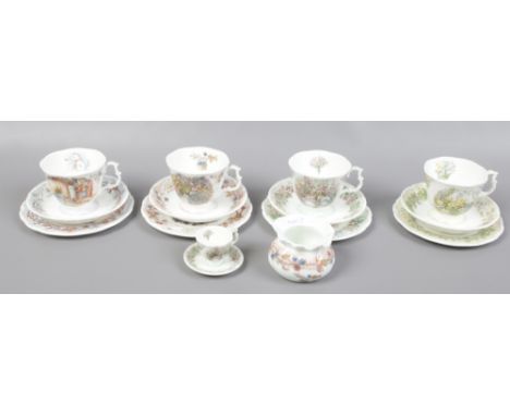 Four Royal Doulton Bramley Hedge four seasons bone china trios, along with a miniature cup and a trinket dish.