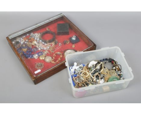 A small display case and box of costume jewellery to include manual wristwatch, rings, beads etc.