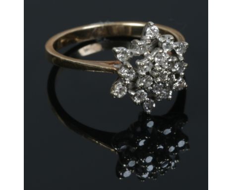 A 9ct gold diamond snowflake cluster ring. Size P.&nbsp;