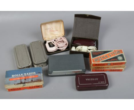 A collection of Rolls razors including boxed examples and various cased vintage electric razors including Viceroy and Philish