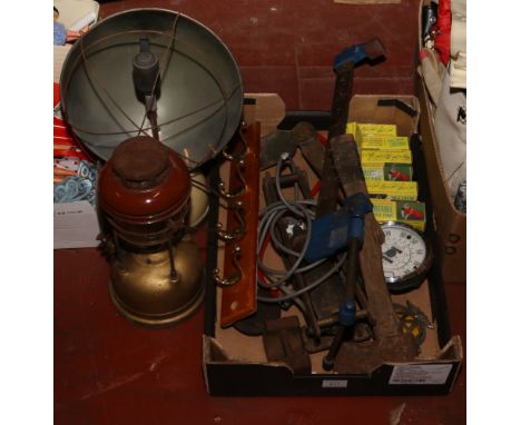 A box of miscellaneous tools, boxed portable fans and two Tilley lamps.