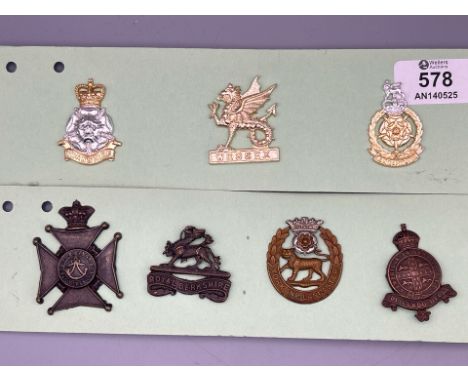 Group of British Military Insignia for the Yorkshire Brigade, Wessex Brigade, Lancastrian Brigade, the King's Royal Rifle Cor