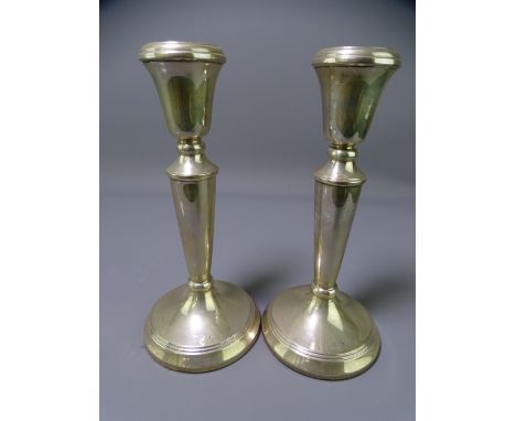 SILVER CANDLESTICKS, a pair, Birmingham 1988, maker M Kamin &amp; Co, 18cms H filled