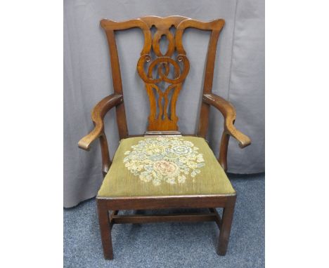 ANTIQUE MAHOGANY CHIPPENDALE STYLE ARMCHAIR with pierced scroll carved back, shaped and swept arms with scroll-end detail, dr