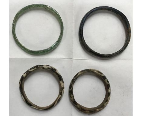 A Collection of Rare Roman funeral offering glass Bangles, North African. The First Green glass Bangle Approximately 8cm diam