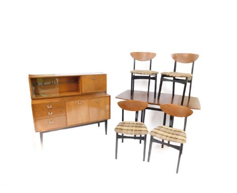 A Nathan 1950's teak and ebonised dining suite, comprising a sideboard with drop flap drinks cabinet, and glazed glasses cabi