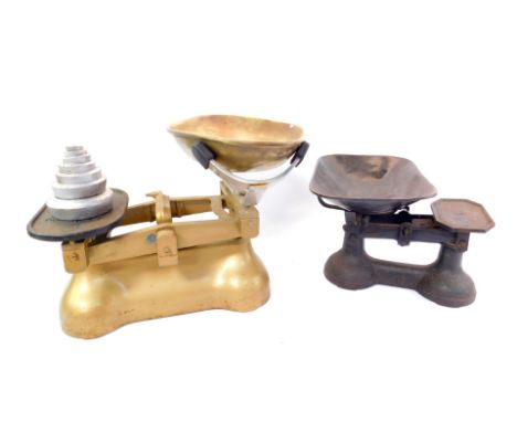 Gold painted cast iron Avery kitchen scales with weights, and a further set of cast iron scales.