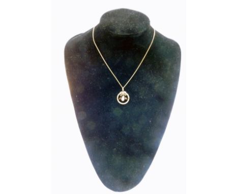 A 9ct gold blister pearl and amethyst circular pendant on chain, of circular reef and swag form, 3.9g.