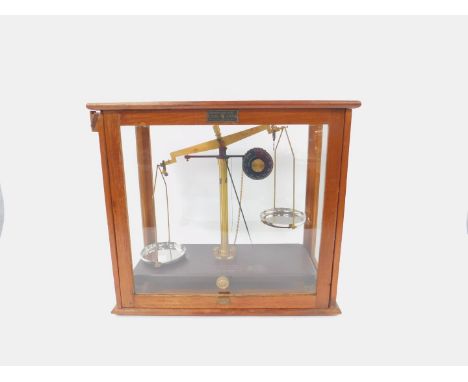 A set of early 20thC Griffin &amp; George Ltd chain driven pharmacy scales,  Regd no.830303, brass frame with white metal pan