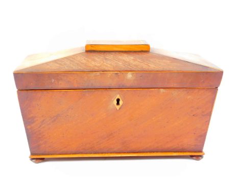 A Regency sarcophagus tea caddy, with rosewood cross banding and boxwood line inlay, twin division with lids, raised on bun f