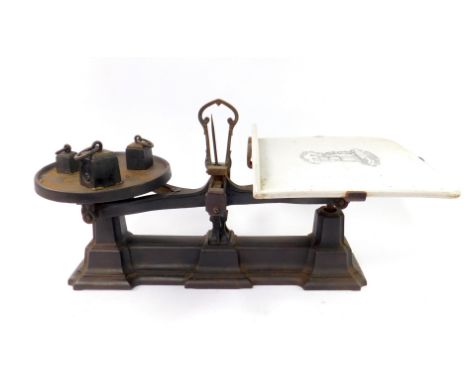 A set of Victorian cast iron Justitia Et Fides grocers scale, with a printed enamel tray, and three weights, 4oz, 8oz and 1lb