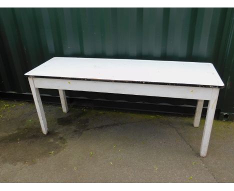 A mid 20thC cream painted wooden and enamel food preparation table, 76cm H, 184cm W, 62cm D.
