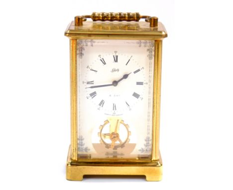 A Schatz brass cased carriage clock, rectangular dial bearing Roman numerals, with visible escapement, 8-day movement, stampe