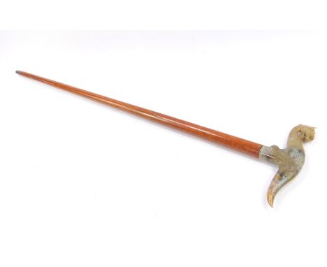 A Quing late 19thC jade topped walking stick, carved as a phoenix on a wooden shaft, 85cm L. .£250-350