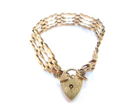 A 9ct gold four bar gate bracelet, with a heart shaped lock, 10g.