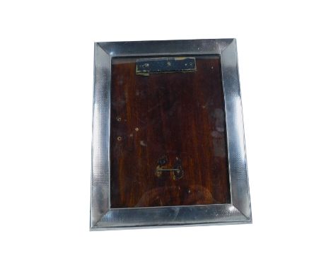 A George V silver strut photograph frame, with engine turned decoration, Birmingham 1926, aperture 19.5cm H, 14.5cm W, frame 