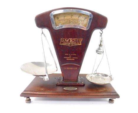 A set of early 20thC  W &amp; T Avery Ltd grocery scales,  Regd no.694226, metal with a faux wood finish, to weigh to 1lb, mo