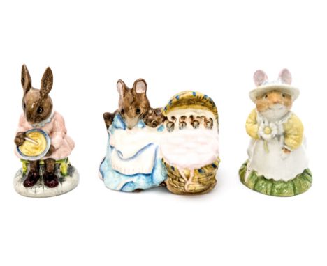 A Beswick 'Hunca Munca' figure with Royal Doulton 'Primrose Woodhouse' and 'Buntie Bunnykins'