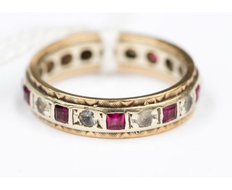 A 9 carat gold ruby and diamond eternity ring, size K, approx 3 gms