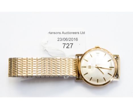A 9ct gold cased Tissot gentleman's watch with date window, replacement expanding bracelet 