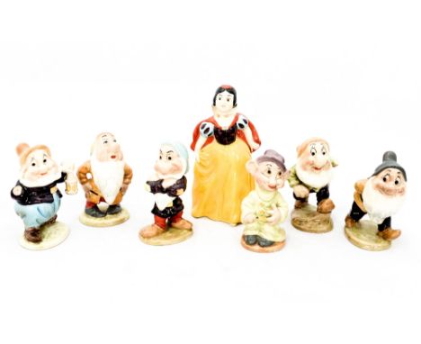 A Beswick Snow White and Dwarfs collection including, 'Dopey' (1325) 'Grumpy' (1330) 'Sleepy' (1831) 'Sneezy' (1328) 'Bashful