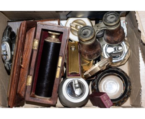 A box containing vintage cigarette lighters, Jockey Club Paris binoculars, Benlow motorist's pipe lighters