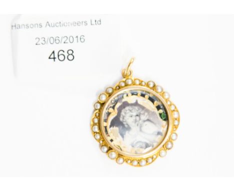 A 19th Century 15 ct gold circular shaped pendant having enamel of lady feeding dove (af), the border set split pearls, stamp