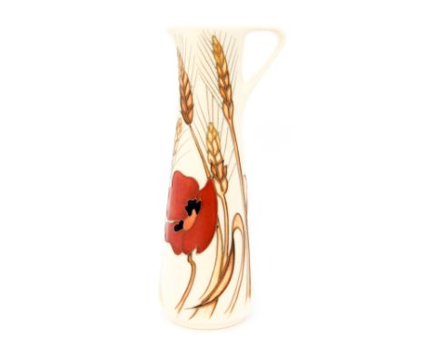 A Moorcroft pitcher in the 'Harvest Poppy' design standing approx 19 cm high 