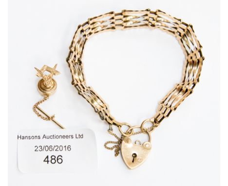 A 9 ct gold Masonic tie tack 1.5 grms approx. together with a 9 ct gold gate bracelet 10.1 grms approx.