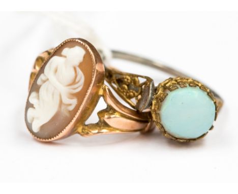 An opal, unusually set in a gilt and white metal ring together with a 9 ct rose gold classical cameo ring, Chester 1917, size