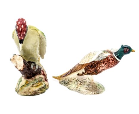A Beswick 'Woodpecker', 1218 and a Beswick 'Pheasant' in take off position, 850 (2)