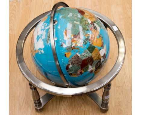 An articulated floor standing or table globe set with hard stone and semi-precious gem stones as countries, including abalone