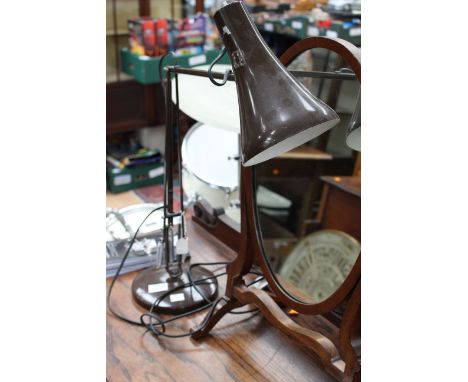 An original Herbert Terry Anglepoise desk light in brown, raised on a circular base stamped 'Anglepoise Lighting Limited, Mad