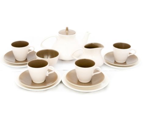 A Poole pottery tea service with teapot, milk and sugar, in two tone brown/beige, 1960s, plus two Poole cockle plates (approx