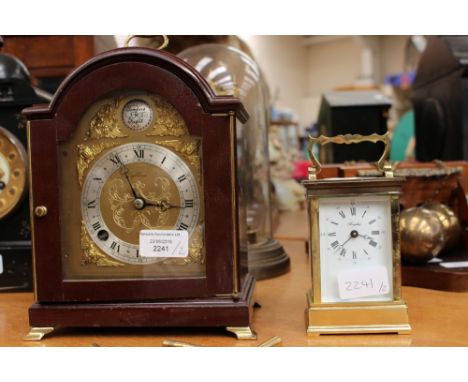 A mantle clock along with a brass carriage clock