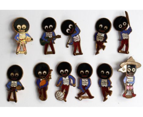 A collection of eleven Robinsons Golly Golden Shred enamel badges, including sports, scouts and music themes