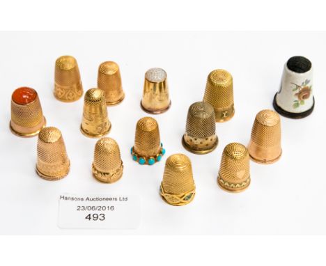 A quantity of yellow metal and enamel decorated thimbles (15)