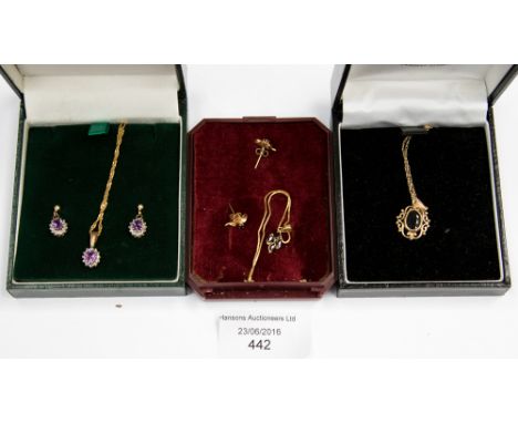 A box set of amethyst earrings and pendant, set with clear stones, with 9 ct gold necklace and settings, with a further boxed