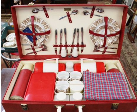 A 1950s Brexton Luxury Picnic set, model 6626, containing ceramic plates, cutlery, flasks, boxes condiments, mugs etc fitted 